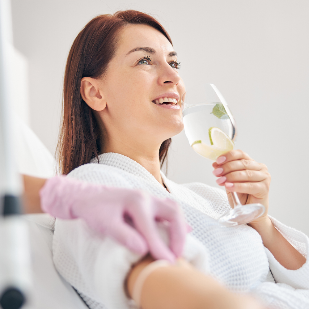 a woman holding a toothbrush
