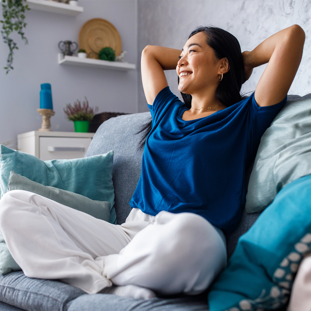 a woman sitting on a bed