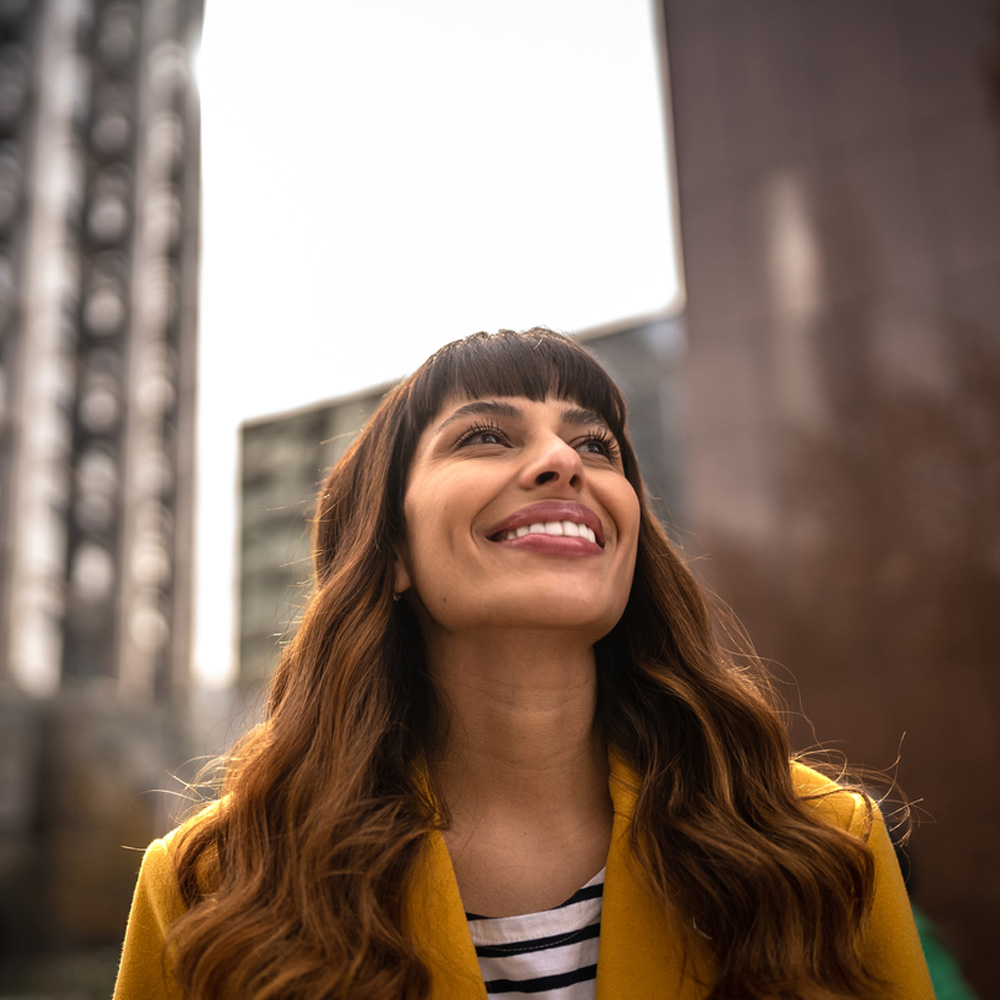 a woman standing in front of a building